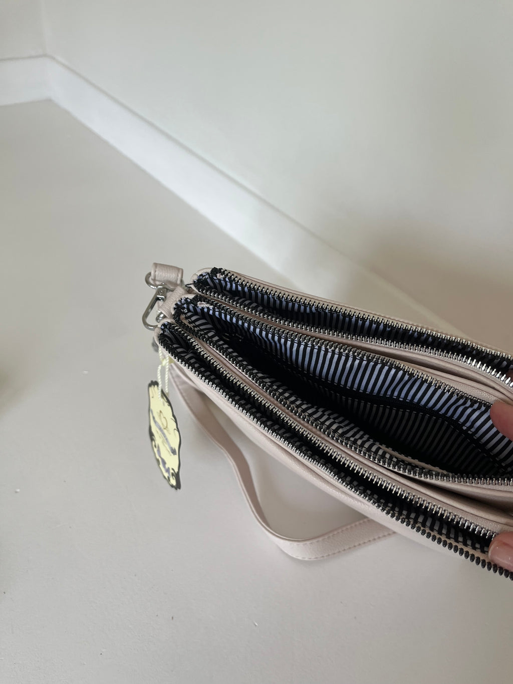 Cream cross body bag